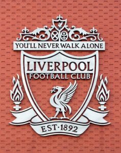 Liverpool FC's Grey Badge on a Red Wall